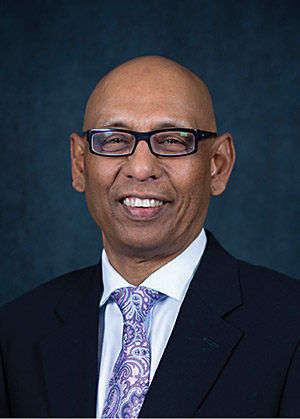 Portrait of John Taya, Executive Director, Organisational Development